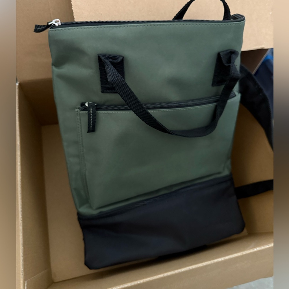New, never used. Backpack with extra room at the bottom